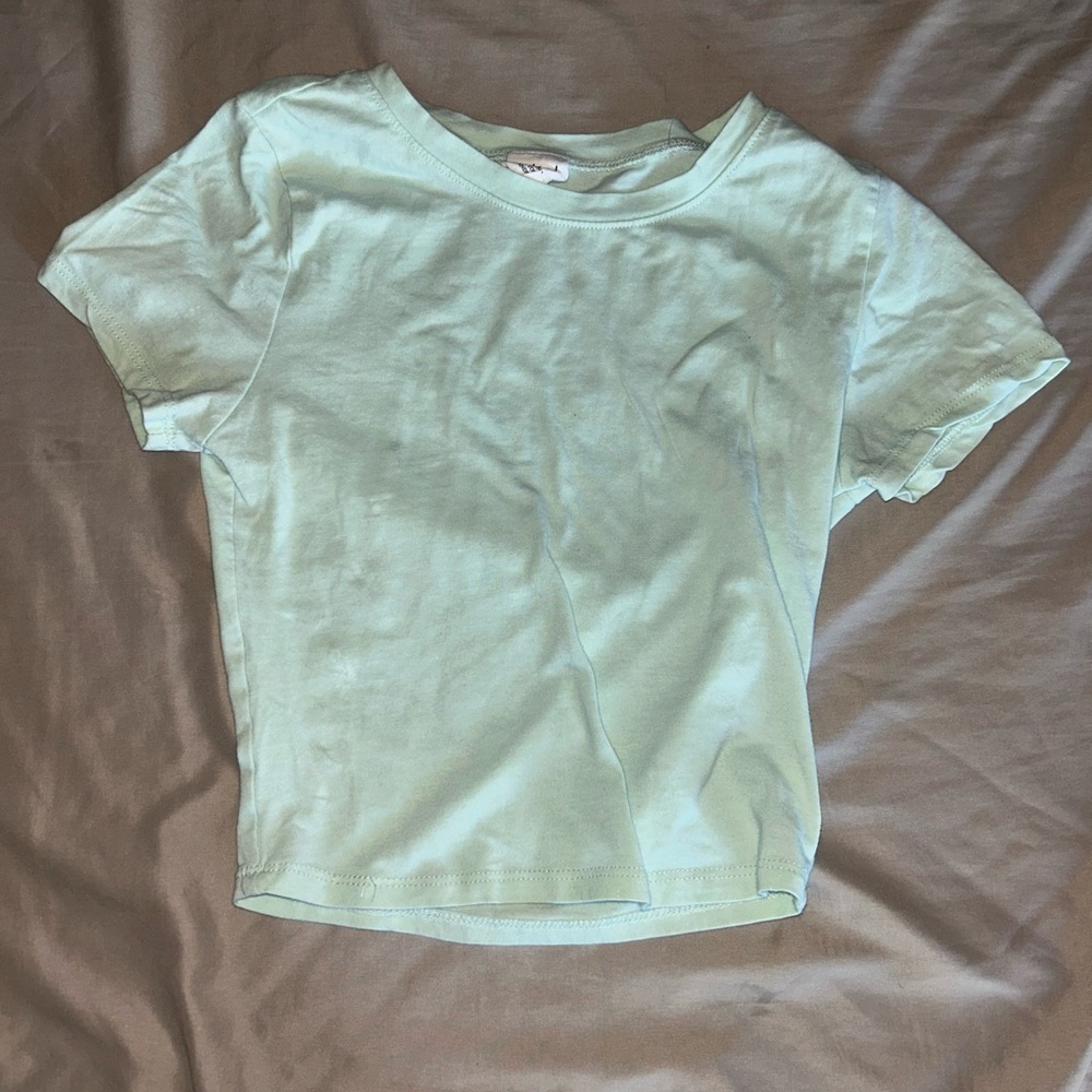 Selling a teal baby tee!